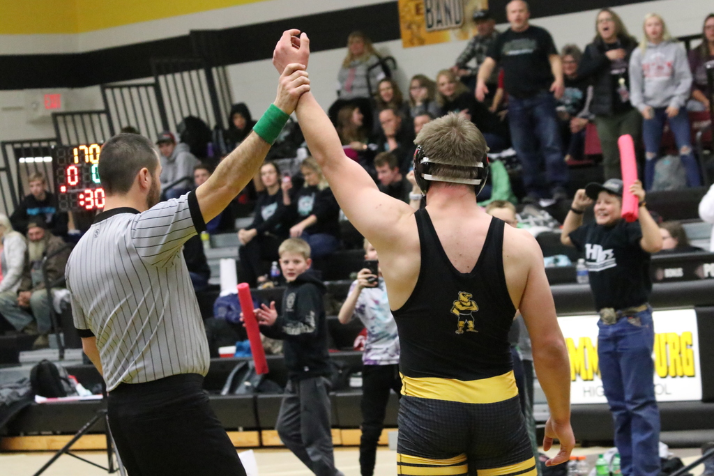Jon Lace's arm is raised for his 100th career win. 