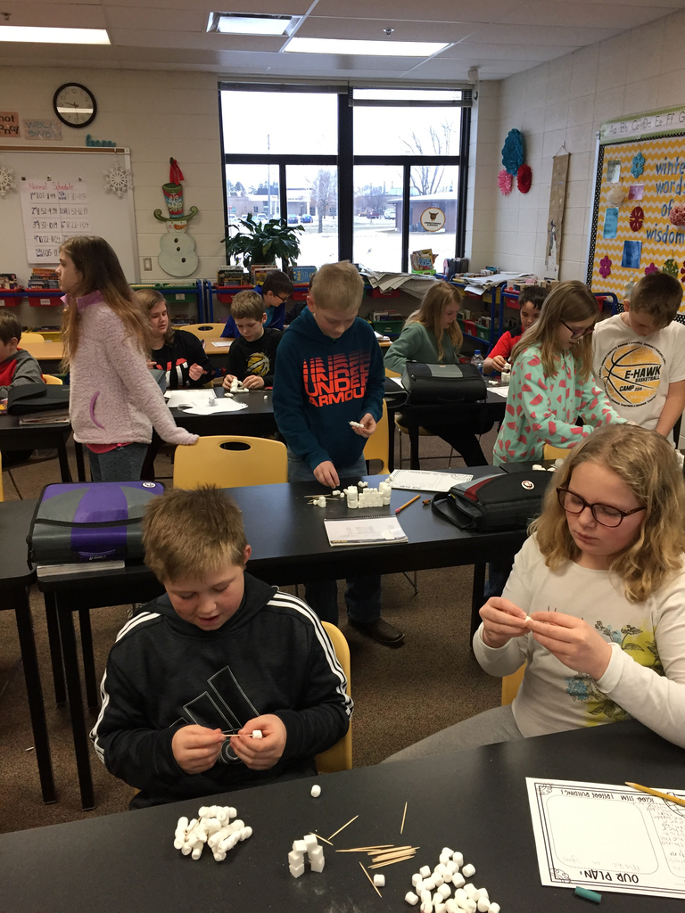 5th grade students building models of snow forts and igloos.